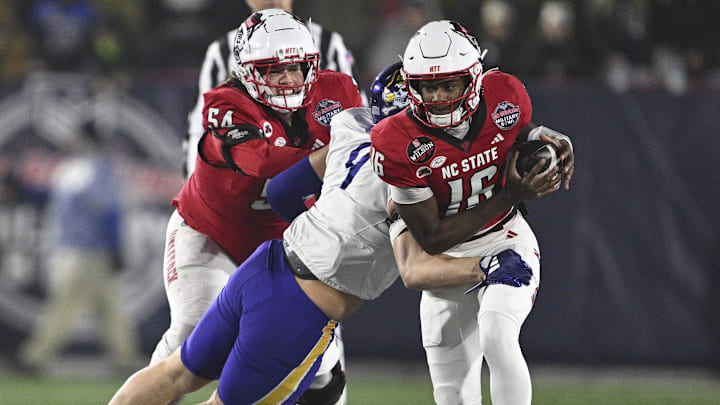 Dec 28, 2024; Annapolis, MD, USA; East Carolina Pirates defensive lineman J.D. Lampley (9) sacks North Carolina State Wolfpack quarterback CJ Bailey (16) during the first half of the Go Bowling Military Bowl at Navy-Marine Corps Memorial Stadium. Mandatory Credit: Tommy Gilligan-Imagn Images Dec 28, 2024; Annapolis, MD, USA; East Carolina Pirates defensive lineman J.D. Lampley (9) sacks North Carolina State Wolfpack quarterback CJ Bailey (16) during the first half of the Go Bowling Military Bowl at Navy-Marine Corps Memorial Stadium. Mandatory Credit: Tommy Gilligan-Imagn Images