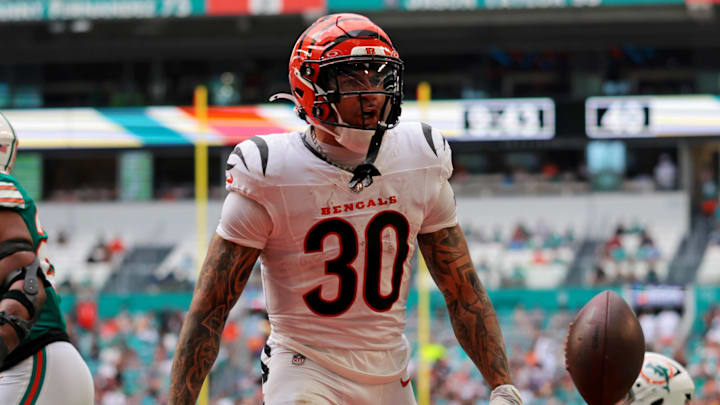 Dec 21, 2025; Miami Gardens, Florida, USA; Cincinnati Bengals running back Chase Brown (30) scores a touchdown during the third quarter against the Cincinnati Bengals at Hard Rock Stadium. Mandatory Credit: Sam Navarro-Imagn Images