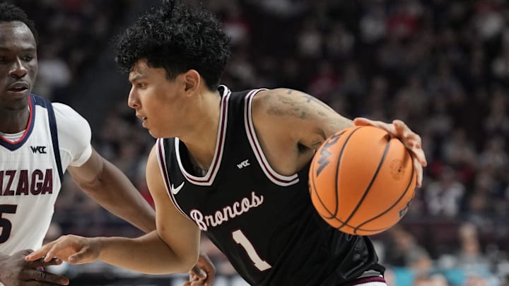 March 10, 2026; Las Vegas, NV, USA; Santa Clara Broncos guard Christian Hammond (1) dribbles the basketball against Gonzaga Bulldogs forward Emmanuel Innocenti (5) during the second half at Orleans Arena. Mandatory Credit: Kyle Terada-Imagn Images