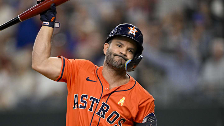 Sep 7, 2025; Arlington, Texas, USA; Houston Astros designated hitter Jose Altuve (27) throws his bat after he strikes out against the Texas Rangers during the eighth inning at Globe Life Field. Mandatory Credit: Jerome Miron-Imagn Images