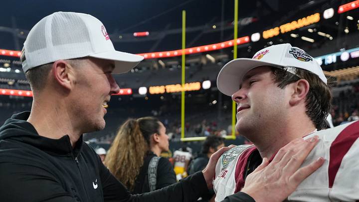 Dec 27, 2024; Las Vegas, NV, USA; Southern California Trojans head coach Lincoln Riley embraces offensive lineman Kilian O'Connor (67) after the game against the Texas A&M Aggies at Allegiant Stadium. Dec 27, 2024; Las Vegas, NV, USA; Southern California Trojans head coach Lincoln Riley embraces offensive lineman Kilian O'Connor (67) after the game against the Texas A&M Aggies at Allegiant Stadium.