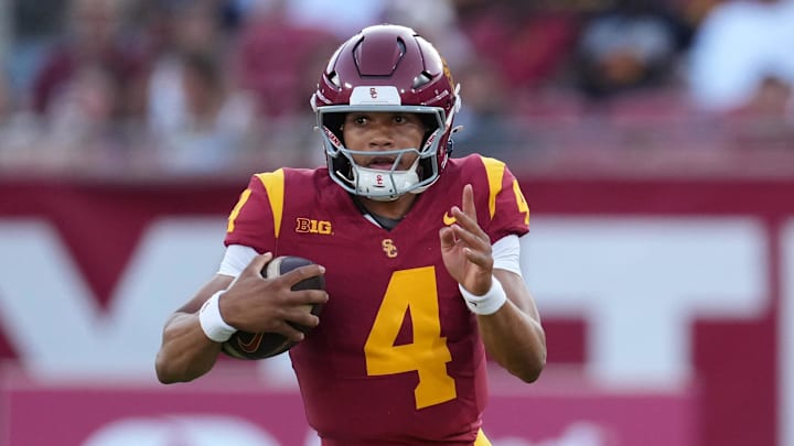 Aug 30, 2025; Los Angeles, California, USA; Southern California Trojans quarterback Husan Longstreet (4) carries the ball against the Missouri State Bears in the second half at United Airlines Field at Los Angeles Memorial Coliseum. Mandatory Credit: Kirby Lee-Imagn Images