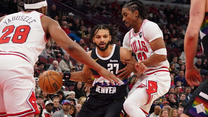 Feb 7, 2026; Chicago, Illinois, USA; Chicago Bulls forward Guerschon Yabusele (28) defends Denver Nuggets guard Jamal Murray (27) during the first half at United Center. Mandatory Credit: David Banks-Imagn Images