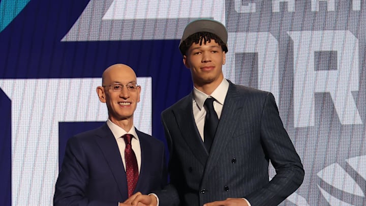 Jun 26, 2024; Brooklyn, NY, USA; Tidjane Salaun poses for photos with NBA commissioner Adam Silver after being selected in the first round by the Charlotte Hornets in the 2024 NBA Draft at Barclays Center. Mandatory Credit: Brad Penner-Imagn Images