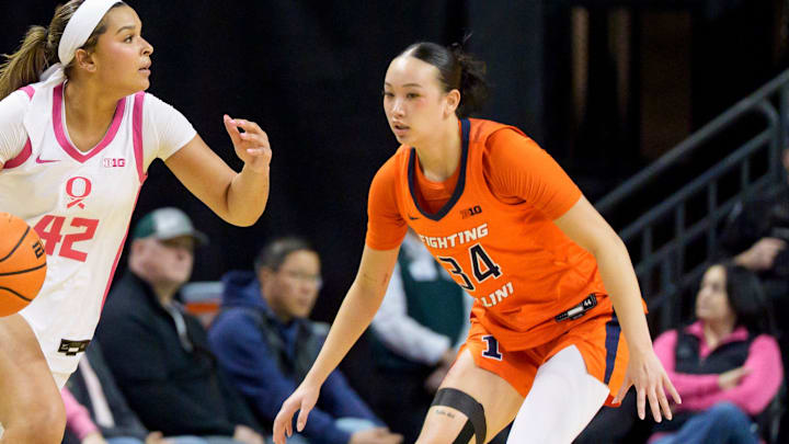 Oregon guard Avary Cain, left, presses past Illinois guard Maddie Webber as the Oregon Ducks host the Illinois Fighting Illini on Feb. 4, 2026, at Matthew Knight Arena in Eugene, Oregon.