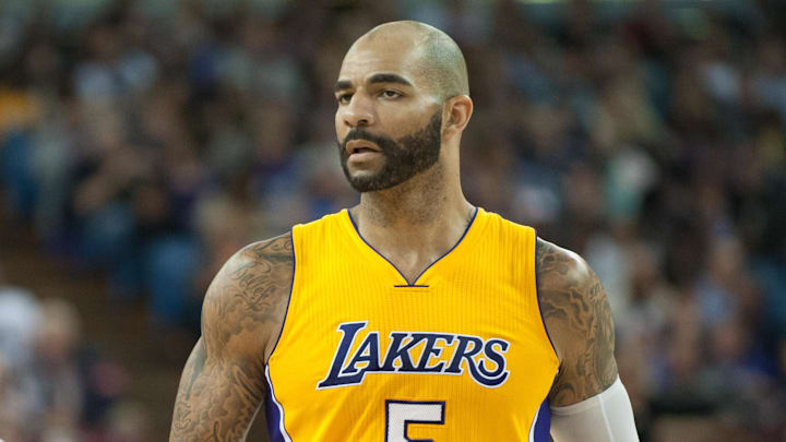 Apr 13, 2015; Sacramento, CA, USA; Los Angeles Lakers forward Carlos Boozer (5) celebrates with guard Jordan Clarkson (6) after scoring a basket against the Sacramento Kings during the fourth quarter at Sleep Train Arena. The Sacramento Kings defeated the Los Angeles Lakers 102-92. Mandatory Credit: Ed Szczepanski-Imagn Images