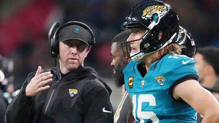 Oct 19, 2025; London, United Kingdom; Jacksonville Jaguars head coach Liam Coen talks with quarterback Trevor Lawrence (16) on the sidelines during the second half of an NFL International Series game at Wembley Stadium. Mandatory Credit: Kirby Lee-Imagn Images