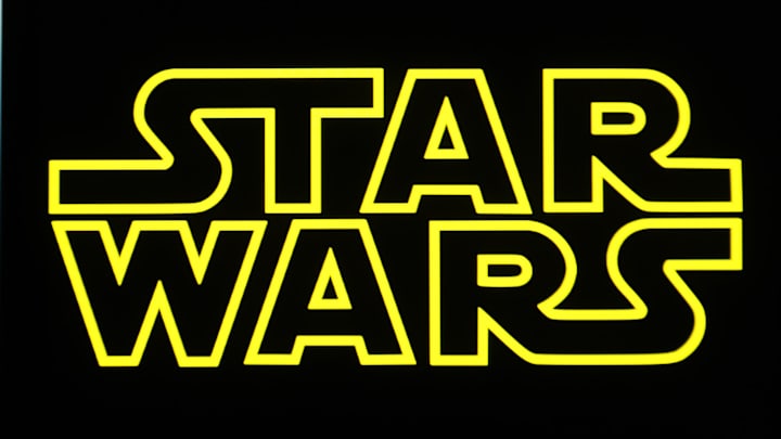 In this photo illustration, a Star Wars logo is seen on a...