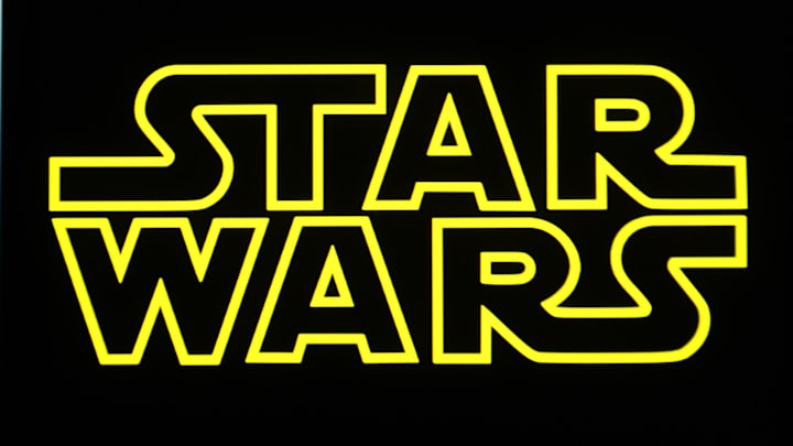 In this photo illustration, a Star Wars logo is seen on a...