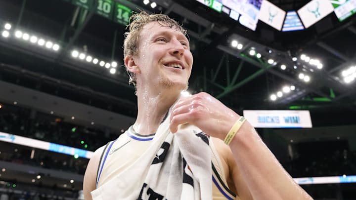 Milwaukee Bucks guard AJ Green (20) reacts after being doused with water following the game against the Brooklyn Nets at Fiserv Forum on April 10, 2026.