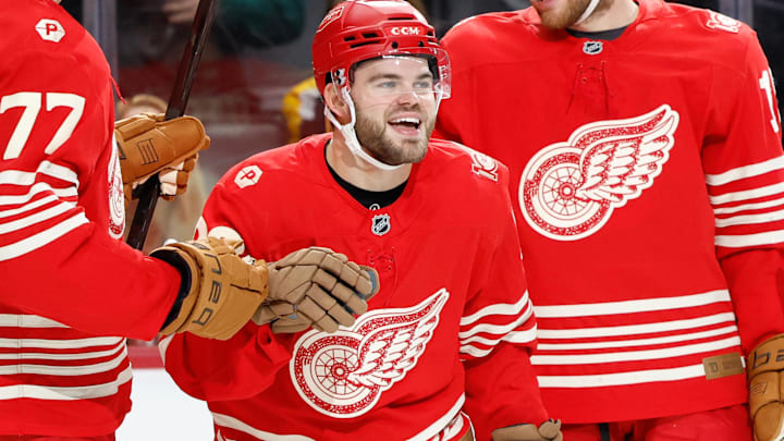 Dec 2, 2025; Detroit, Michigan, USA;  Detroit Red Wings right wing Alex Debrincat (93) receives congratulations from teammates after scoring in the second period against the Boston Bruins at Little Caesars Arena. Mandatory Credit: Rick Osentoski-Imagn Images
