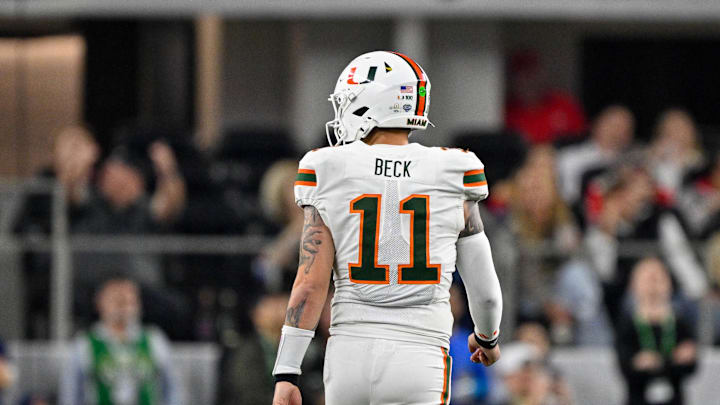 Dec 31, 2025; Arlington, TX, USA; Miami Hurricanes quarterback Carson Beck (11) walks up the field during the 2025 Cotton Bowl and quarterfinal game of the College Football Playoff at AT&T Stadium. Mandatory Credit: Jerome Miron-Imagn Images