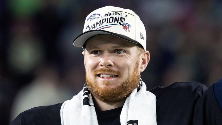 Seattle Seahawks quarterback Sam Darnold celebrates with the Vince Lombardi Trophy.