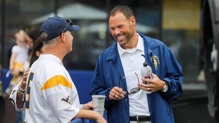 Sep 5, 2026; Morgantown, West Virginia, USA; West Virginia University Director of Athletics Wren Baker talks to fans before the game against the Coastal Carolina Chanticleers at Milan Puskar Stadium. Mandatory Credit: Ben Queen-Imagn Images Sep 5, 2026; Morgantown, West Virginia, USA; West Virginia University Director of Athletics Wren Baker talks to fans before the game against the Coastal Carolina Chanticleers at Milan Puskar Stadium. Mandatory Credit: Ben Queen-Imagn Images