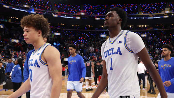 Nov 14, 2025; Inglewood, California, USA;  UCLA Bruins guard Trent Perry (0) and center Xavier Booker (1) leave the court after defeated by the Arizona Wildcats 69-65 at Intuit Dome. Mandatory Credit: Kiyoshi Mio-Imagn Images