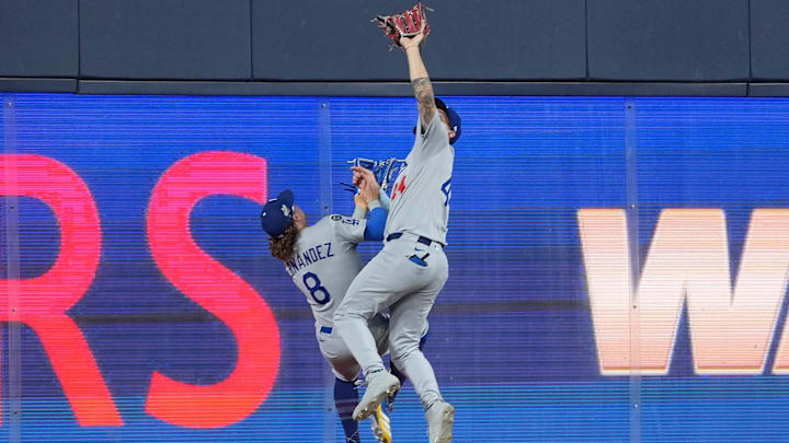 Dodgers center fielder Andy Pages makes a game-saving catch in the ninth inning while colliding with teammate Kiké Hernandez.