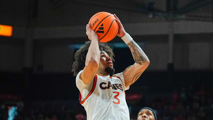 Mar 7, 2026; Coral Gables, Florida, USA; Miami Hurricanes guard Tre Donaldson (3) shoots the ball against the Louisville Cardinals during the second half at Watsco Center. Mandatory Credit: Jeff Romance-Imagn Images