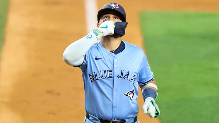 May 28, 2025; Arlington, Texas, USA; Toronto Blue Jays shortstop Bo Bichette (11) reacts after hitting a two-run home run during the ninth inning against the Texas Rangers at Globe Life Field