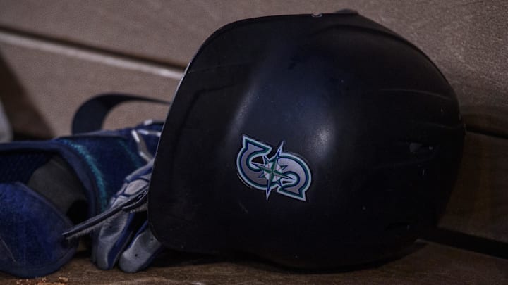 Jun 5, 2022; Arlington, Texas, USA; A view of a Seattle Mariners batting helmet and logo during the game between the Texas Rangers and the Seattle Mariners at Globe Life Field. Mandatory Credit: Jerome Miron-Imagn Images Jun 5, 2022; Arlington, Texas, USA; A view of a Seattle Mariners batting helmet and logo during the game between the Texas Rangers and the Seattle Mariners at Globe Life Field. Mandatory Credit: Jerome Miron-Imagn Images