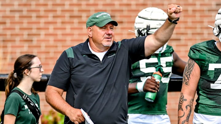 Michigan State's offensive line coach Jim Michalczik works with the team during the first day of football camp on Tuesday, July 30, 2024, in East Lansing. Michigan State's offensive line coach Jim Michalczik works with the team during the first day of football camp on Tuesday, July 30, 2024, in East Lansing.