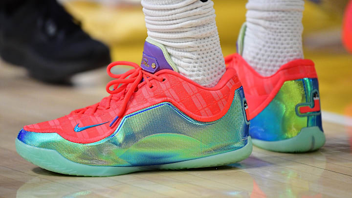 LeBron James wears the Nike LeBron 23 "Stocking Stuffer" colorway. LeBron James wears the Nike LeBron 23 "Stocking Stuffer" colorway.