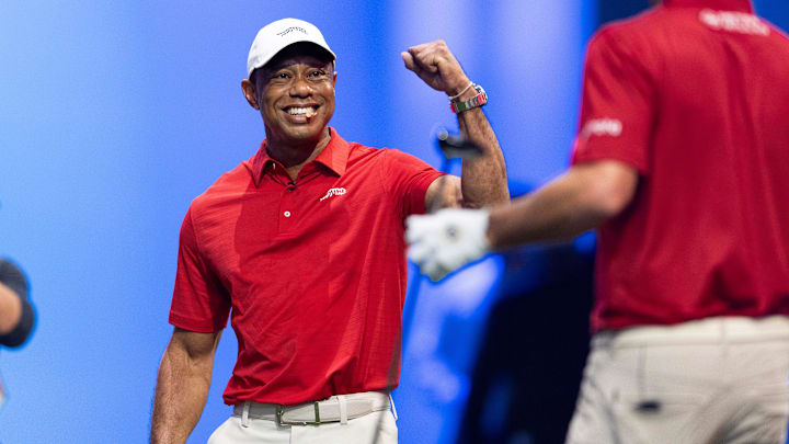 Tiger Woods of Jupiter Links cheers for his teammate during a TGL match against New York at SoFi Center on Jan. 13, 2026.