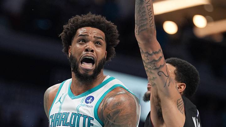 Apr 14, 2026; Charlotte, North Carolina, USA; Charlotte Hornets forward Miles Bridges (0) goes to the basket against Miami Heat center Kel'el Ware (7) during the second half during the play-in rounds between the Charlotte Hornets and the Miami Heat of the 2026 NBA Playoffs at Spectrum Center. Mandatory Credit: Jim Dedmon-Imagn Images Apr 14, 2026; Charlotte, North Carolina, USA; Charlotte Hornets forward Miles Bridges (0) goes to the basket against Miami Heat center Kel'el Ware (7) during the second half during the play-in rounds between the Charlotte Hornets and the Miami Heat of the 2026 NBA Playoffs at Spectrum Center. Mandatory Credit: Jim Dedmon-Imagn Images
