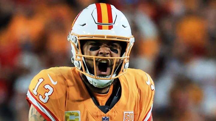 Dec 11, 2025; Tampa, Florida, USA; Tampa Bay Buccaneers wide receiver Mike Evans (13) reacts after catching a pass against Atlanta Falcons safety Jessie Bates III (3) (obscured) during the third quarter at Raymond James Stadium. Mandatory Credit: Kim Klement Neitzel-Imagn Images