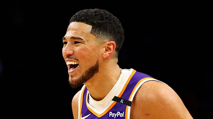 Phoenix Suns guard Devin Booker (1) reacts after a play during the first quarter against the Milwaukee Bucks at Footprint Center on March 24, 2025.