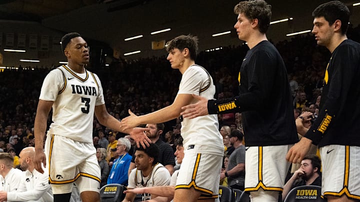 Iowa forward Cam Manyawu (3) high-fives teammates after fouling out of a game against the Michigan Wolverines March 5, 2026 at Carver-Hawkeye Arena in Iowa City, Iowa.