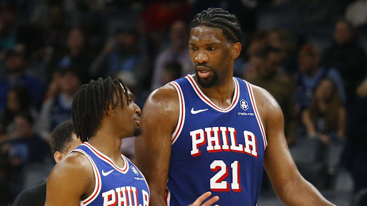 Apr 6, 2024; Memphis, Tennessee, USA; Philadelphia 76ers guard Tyrese Maxey (0) and center Joel Embiid (21) talk as they walk off the court at half time against the Memphis Grizzlies at FedExForum. Mandatory Credit: Petre Thomas-Imagn Images
