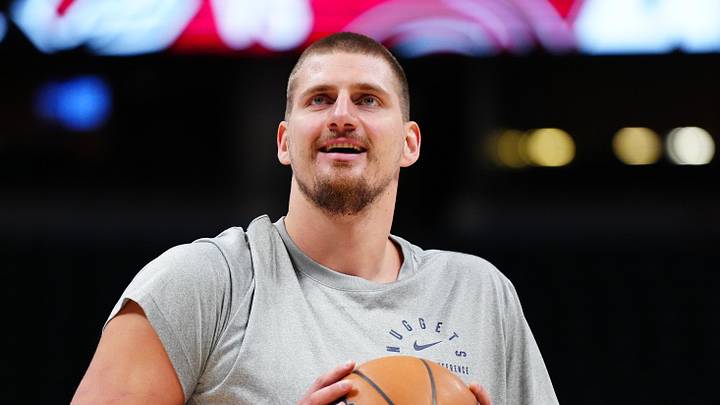 Dec 28, 2024; Denver, Colorado, USA; Denver Nuggets center Nikola Jokic (15) warms up before the game against the Detroit Pistons at Ball Arena. Mandatory Credit: Ron Chenoy-Imagn Images