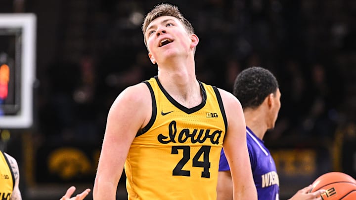 Feb 22, 2025; Iowa City, Iowa, USA; Iowa Hawkeyes forward Pryce Sandfort (24) reacts during the first half against the Washington Huskies as guard Brock Harding (2) looks on at Carver-Hawkeye Arena. Mandatory Credit: Jeffrey Becker-Imagn Images Feb 22, 2025; Iowa City, Iowa, USA; Iowa Hawkeyes forward Pryce Sandfort (24) reacts during the first half against the Washington Huskies as guard Brock Harding (2) looks on at Carver-Hawkeye Arena. Mandatory Credit: Jeffrey Becker-Imagn Images