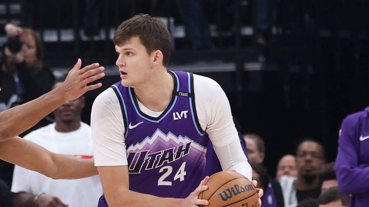 Oct 27, 2025; Salt Lake City, Utah, USA; Utah Jazz center Walker Kessler (24) looks to pass against Phoenix Suns forward Oso Ighodaro (11) during the first quarter at Delta Center. Mandatory Credit: Rob Gray-Imagn Images