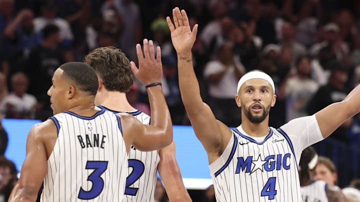Orlando Magic guard Jalen Suggs reacts with guard Desmond Bane after a play against the Miami Heat. Orlando Magic guard Jalen Suggs reacts with guard Desmond Bane after a play against the Miami Heat.