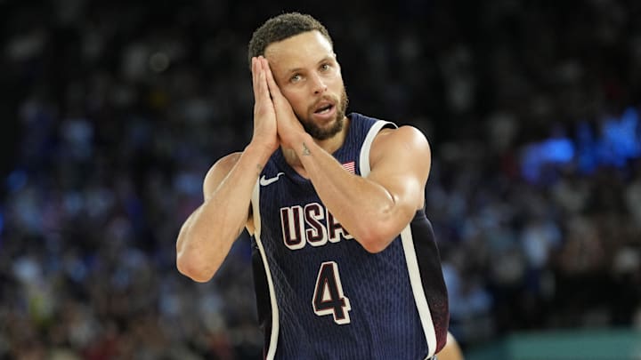 Aug 10, 2024; Paris, France; United States shooting guard Stephen Curry (4) reacts in the second half against France in the men's basketball gold medal game during the Paris 2024 Olympic Summer Games at Accor Arena. Mandatory Credit: Kyle Terada-Imagn Images