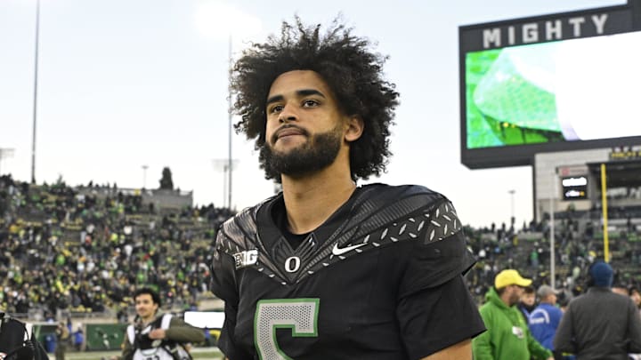 Nov 22, 2025; Eugene, Oregon, USA; Oregon Ducks quarterback Dante Moore (5) walks off the field after the game against the Southern California Trojans at Autzen Stadium. Mandatory Credit: Troy Wayrynen-Imagn Images Nov 22, 2025; Eugene, Oregon, USA; Oregon Ducks quarterback Dante Moore (5) walks off the field after the game against the Southern California Trojans at Autzen Stadium. Mandatory Credit: Troy Wayrynen-Imagn Images