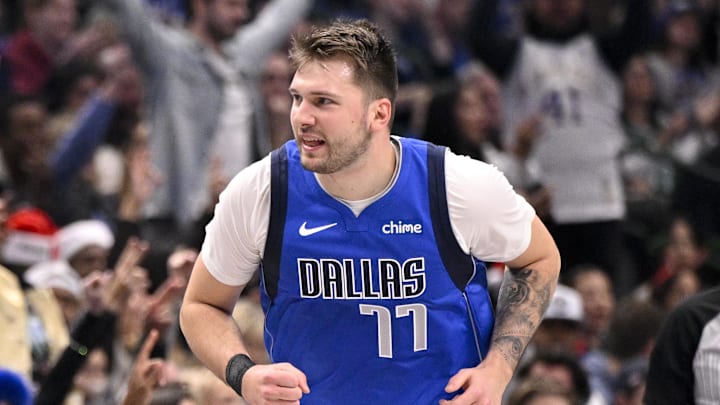 Dallas Mavericks guard Luka Doncic reacts to scoring a basket.