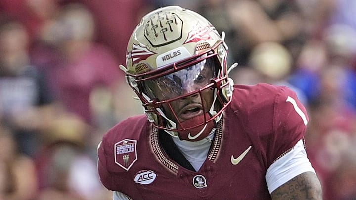 Oct 11, 2025; Tallahassee, Florida, USA; Florida State Seminoles quarterback Thomas Castellanos (1) looks to throw as he is pressured by Pittsburgh Panthers linebacker Kyle Louis (9) during the first half at Doak S. Campbell Stadium. Mandatory Credit: Melina Myers-Imagn Images
