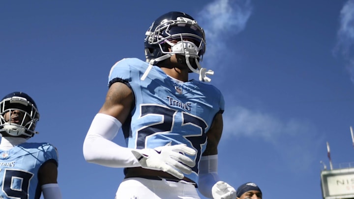 Nov 16, 2025; Nashville, Tennessee, USA; Tennessee Titans safety Kevin Winston Jr. (23) and cornerback Darrell Baker Jr. (39) run onto the field before the game against the Houston Texans at Nissan Stadium. Mandatory Credit: Steve Roberts-Imagn Images