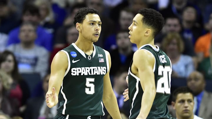 Mar 22, 2015; Charlotte, NC, USA; Michigan State Spartans guard Bryn Forbes (5) celebrates with guard Travis Trice (20) during the second half against the Virginia Cavaliers in the third round of the 2015 NCAA Tournament at Time Warner Cable Arena. Michigan State won 60-54. Mandatory Credit: Bob Donnan-Imagn Images