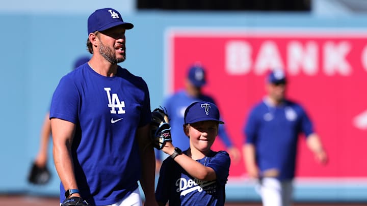 Los Angeles Dodgers pitcher Clayton Kershaw (22) and his son Charley Kershaw before a game against the New York Yankees at Dodger Stadium on May 30.