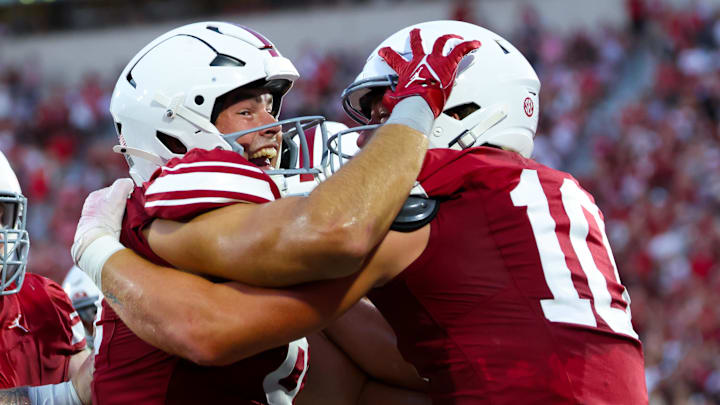 Oklahoma tight ends Jake Roberts (left) and Bauer Sharp (10) celebrate after Roberts' TD against Houston.