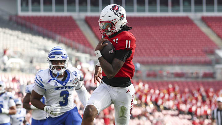 Dec 19, 2025; Tampa, FL, USA; NC State Wolfpack quarterback CJ Bailey (11) runs into the end zone for a touchdown against the Memphis Tigers in the first quarter during the Gasparilla Bowl at Raymond James Stadium. Mandatory Credit: Nathan Ray Seebeck-Image Images Dec 19, 2025; Tampa, FL, USA; NC State Wolfpack quarterback CJ Bailey (11) runs into the end zone for a touchdown against the Memphis Tigers in the first quarter during the Gasparilla Bowl at Raymond James Stadium. Mandatory Credit: Nathan Ray Seebeck-Image Images