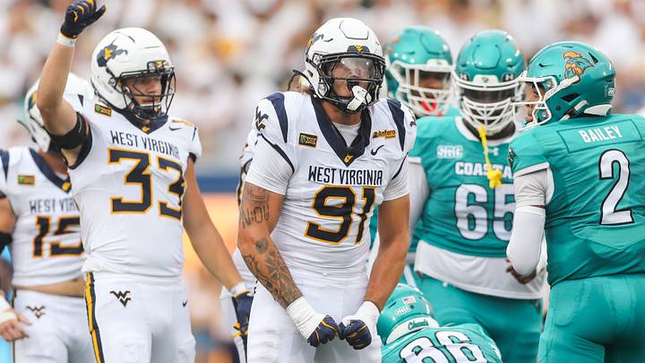 Sep 5, 2026; Morgantown, West Virginia, USA; West Virginia Mountaineers defensive lineman Darius Wiley (91) celebrates after a defensive stop during the first quarter against the Coastal Carolina Chanticleers at Milan Puskar Stadium. Mandatory Credit: Ben Queen-Imagn Images Sep 5, 2026; Morgantown, West Virginia, USA; West Virginia Mountaineers defensive lineman Darius Wiley (91) celebrates after a defensive stop during the first quarter against the Coastal Carolina Chanticleers at Milan Puskar Stadium. Mandatory Credit: Ben Queen-Imagn Images