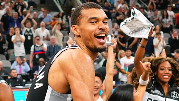 Mar 5, 2026; San Antonio, Texas, USA; San Antonio Spurs forward forward Victor Wembanyama (1) beats a drum and leads fans on a cheer after a victory over the Detroit Pistons at Frost Bank Center. Mandatory Credit: Scott Wachter-Imagn Images