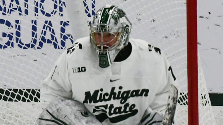 The puck get past MSU goalie Trey Augustine, Saturday, March 23, 2024, during the first period of the Big Ten hockey championship at Munn Ice Arena in East Lansing.