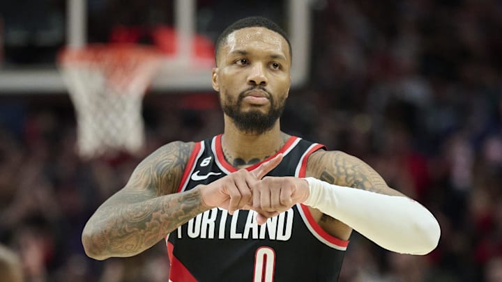 Dec 8, 2022; Portland, Oregon, USA; Portland Trail Blazers guard Damian Lillard (0) celebrates during the second half after scoring a three point basket against the Denver Nuggets at Moda Center. The Nuggets won the game 121-120. Mandatory Credit: Troy Wayrynen-Imagn Images
