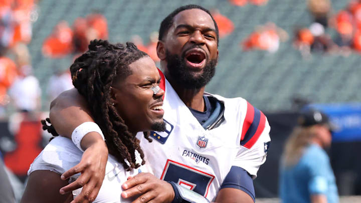 Sep 8, 2024; Cincinnati, Ohio, USA;  New England Patriots quarterback Jacoby Brissett (right) celebrates following the win over the Cincinnati Bengals at Paycor Stadium. Mandatory Credit: Joseph Maiorana-Imagn Images