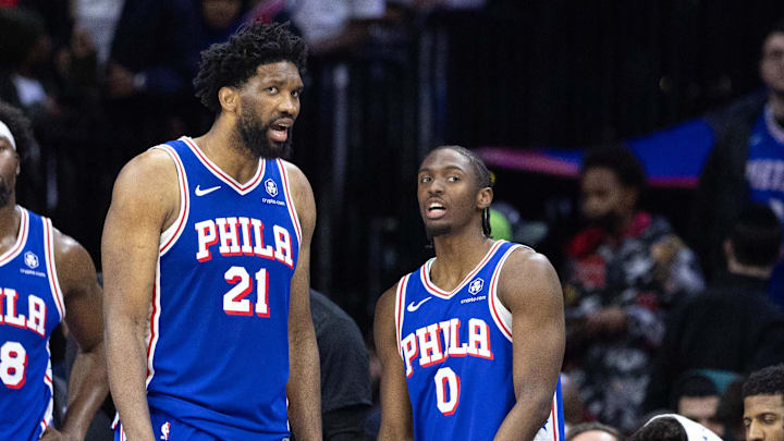 Feb 20, 2025; Philadelphia, Pennsylvania, USA; Philadelphia 76ers center Joel Embiid (21) and guard Tyrese Maxey (0) talk in the final minute of the fourth quarter against the Boston Celtics at Wells Fargo Center. Mandatory Credit: Bill Streicher-Imagn Images